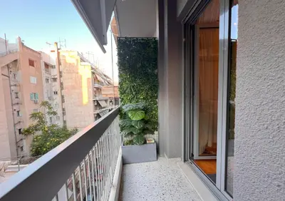 a balcony with a view of a building at Stylish City Studio 8' From 3 Metro Lines 4th Floor in Athens
