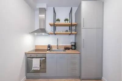 a small kitchen with a sink and a refrigerator at Superior & Spacious Apartment in Athens