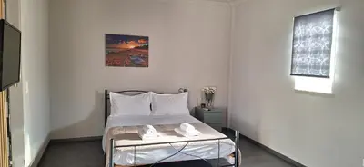 a bedroom with a bed with two towels on it at Studio pellinis in Athens