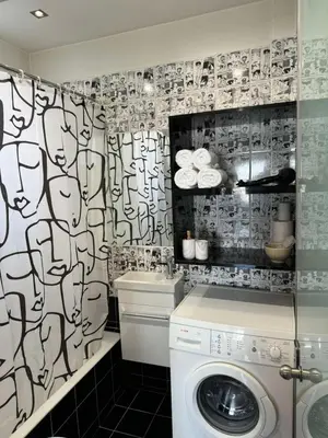a bathroom with a washing machine and a shower curtain at Studio pellinis in Athens