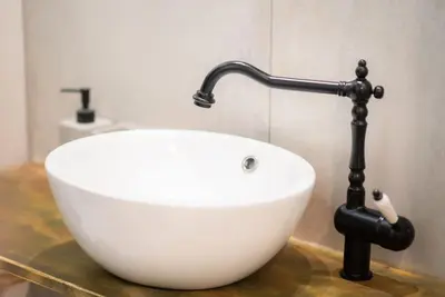 a white sink sitting on a counter in a bathroom at Athens Center Boho Apartment in Athens