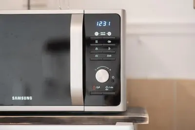 a microwave oven sitting on top of a counter at Athens Center Boho Apartment in Athens