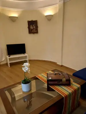 a living room with a glass coffee table with a purse at Underground treasure in Athens