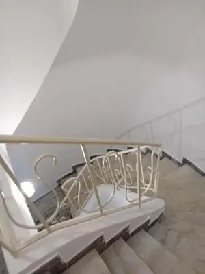 a white table sitting on top of some stairs at Underground treasure in Athens