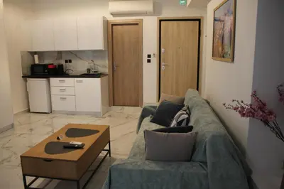 a living room with a couch and a coffee table at Syntagma Luxury Suite by CK-1 in Athens
