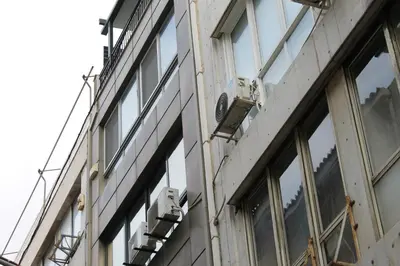 a building with windows on the side of it at Syntagma Luxury Suite by CK-1 in Athens
