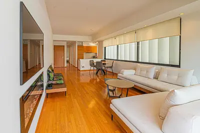 a living room with a couch and a table at Stylish Escape in Glyfada in Athens