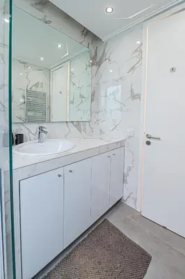 a bathroom with a sink and a mirror at Stylish Escape in Glyfada in Athens