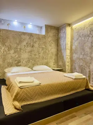 a bedroom with a bed with towels on it at Villa Anastasia in Athens