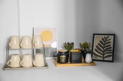 a shelf with cups and other items on it at 3BD apartment with Acropolis & Temple of Zeus view in Athens