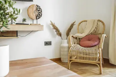 a living room with a chair and a table at 3BD apartment with Acropolis & Temple of Zeus view in Athens