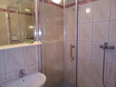 a bathroom with a shower and a sink at Zappion Hotel in Athens