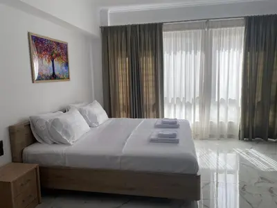 a bedroom with a large bed and a large window at Syntagma Luxury Suites by CK-2 in Athens