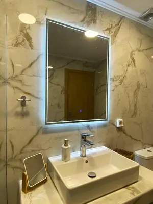 a bathroom with a sink and a mirror at Syntagma Luxury Suites by CK-2 in Athens