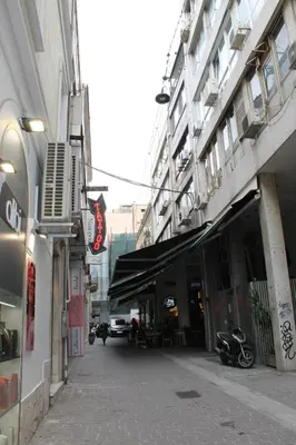 a city street with a building with awnings on it at Syntagma Luxury Suites by CK-2 in Athens