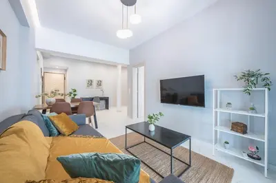 a living room with a couch and a table at Top Ten Lux in Athens