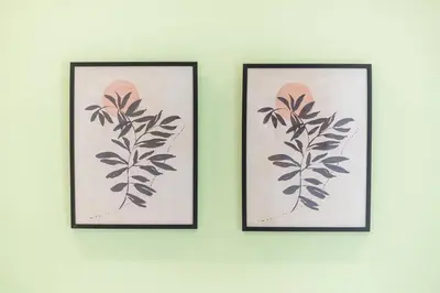two framed prints of a plant on a wall at Top Ten Lux in Athens