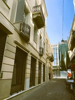 an empty street in front of a building at Syntagma Luxury Suites by CK-3 in Athens