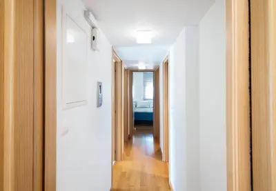 a hallway leading to a bedroom in a house at Bright and Luxurious 2BR Home in Central Glyfada in Athens