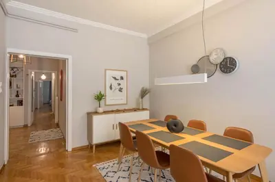 a dining room with a table and chairs at Empyrean Apartment in Athens