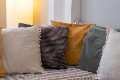 a group of pillows sitting on a couch at Very comfortable, close to Acropolis in Athens
