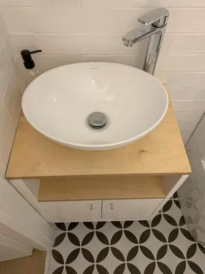 a bathroom with a white sink on a wooden shelf at TINY STUDIOS Under the Akropolis -1- in Athens