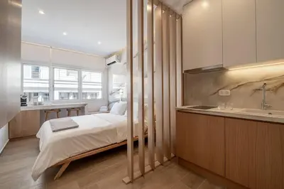 a bedroom with a bed and a sink at Luxurious Studio in the Heart of Athens in Athens