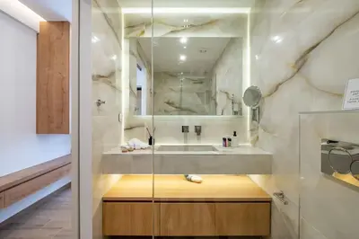 a bathroom with a sink and a mirror at Luxurious Studio in the Heart of Athens in Athens