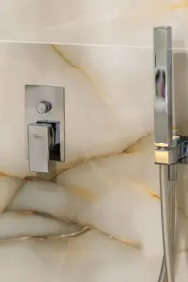 a room with a wall with aiger at Luxurious Studio in the Heart of Athens in Athens