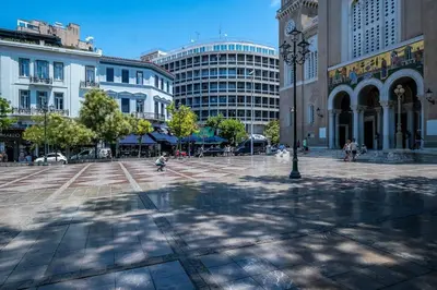 a city square with a clock tower and buildings at Luxurious Studio in the Heart of Athens in Athens