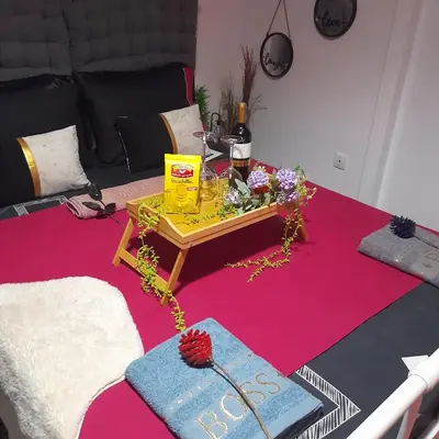 a living room with a table with flowers on it at v&k apartment in Athens