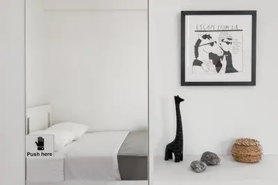 a bedroom with a bed and a picture on the wall at Large terrace studio in Athens