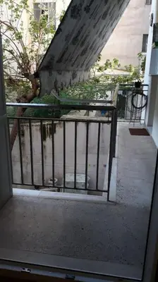 an outside view of a stairway with a metal railing at Cozy and spacious 2 BDR Apt 15 min from the city center in Athens
