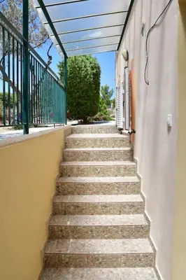 a set of stairs leading up to a building at Kathrine's Cottage in Vagia in Vaia