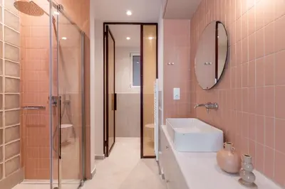 a bathroom with a shower and a sink and a mirror at Culture Retreat Apartments near Archaeological Museum by Upstreet in Athens