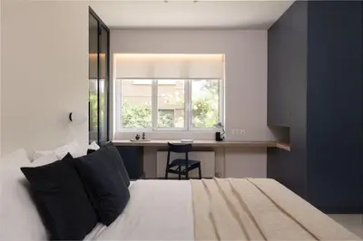 a bedroom with a bed and a desk and a window at Culture Retreat Apartments near Archaeological Museum by Upstreet in Athens