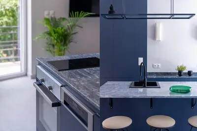 a kitchen with a sink and a counter with stools at Culture Retreat Apartments near Archaeological Museum by Upstreet in Athens
