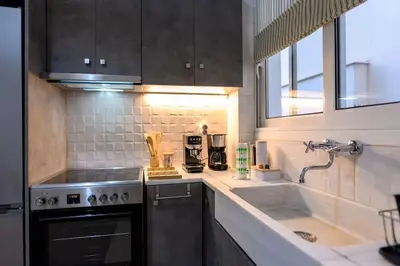 a kitchen with a sink and a stove at Kastella Bohemian Pied a Terre in Piraeus