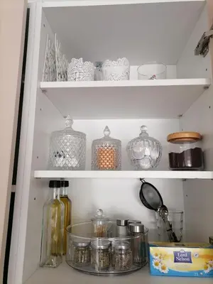 a shelf with jars and other items in a kitchen at Viktoria's garden home in Athens
