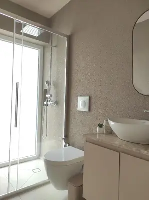 a bathroom with a toilet and a sink and a shower at Viktoria's garden home in Athens