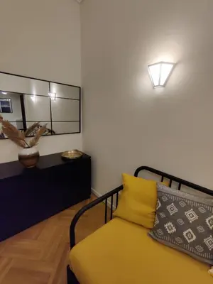 a bedroom with a bed and a large mirror at Pagkrati Apartment 80 in Athens
