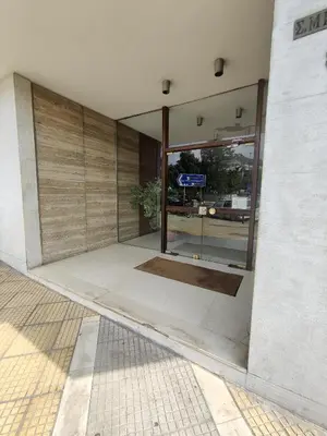 an entrance to a building with a large glass door at Pagkrati Apartment 80 in Athens