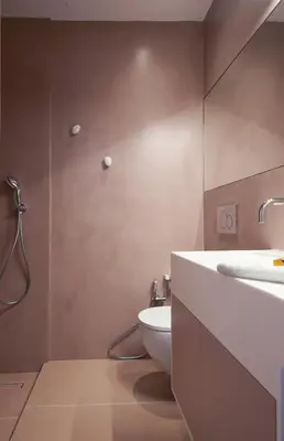 a bathroom with a white toilet and a sink at En Plaka - Athens Elegant Estate in Athens