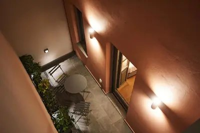 an overhead view of a room with a table and lights at En Plaka - Athens Elegant Estate in Athens