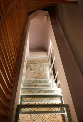 a set of stairs with a glass case on them at En Plaka - Athens Elegant Estate in Athens