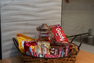 a basket filled with snacks and a jar of soda at just for two in Athens in Athens