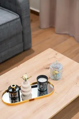 a coffee table with a tray with cups on it at Vitsas House By Greece Apartments in Athens