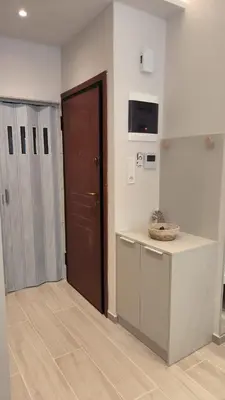 a kitchen with a counter and a door in a room at EstelZan Studio in Athens