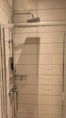 a shower with a glass door in a bathroom at EstelZan Studio in Athens