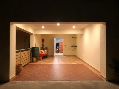 a view of a hallway with a living room at Seaview penthouse by the beach in Kalívia Thorikoú